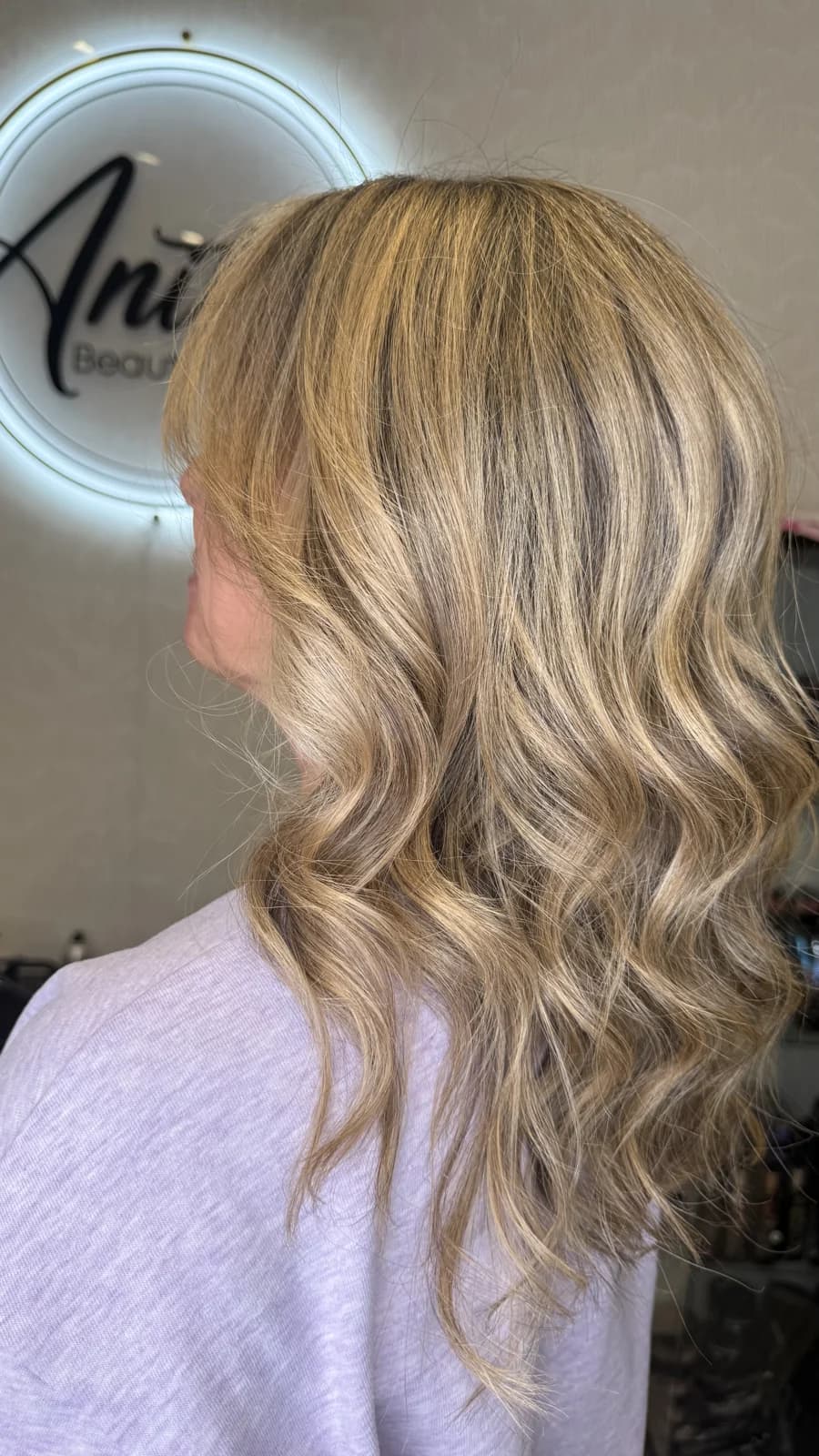 Blonde balayage client in the Anita's Beauty salon, Germantown TN